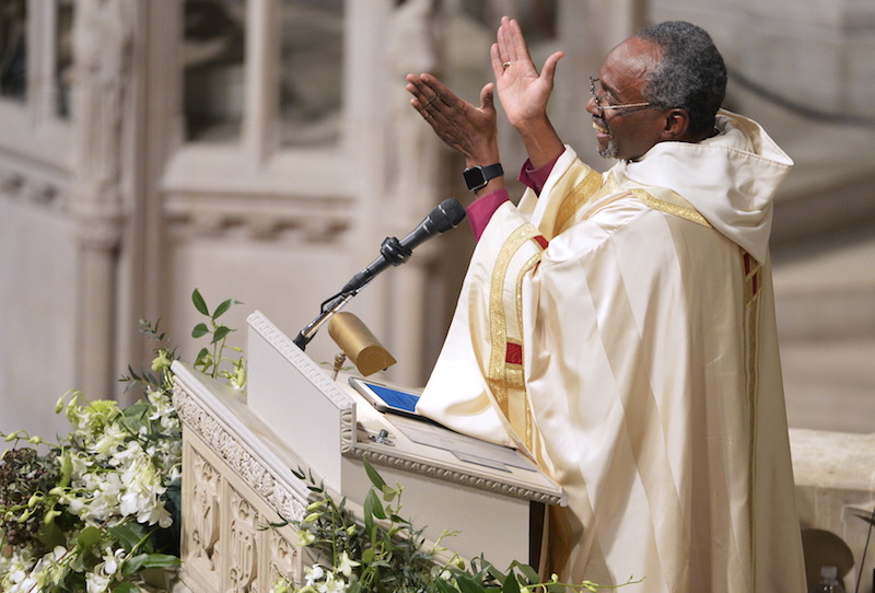 Bishop Michael Bruce Curry applauds as he begins his sermon after his Installation ceremony, at the Washington National Cathedral, in Washington, November 1, 2015. Curry becomes the first African-American Episcopal presiding bishop. Photo courtesy REUTERS Mike Theiler
