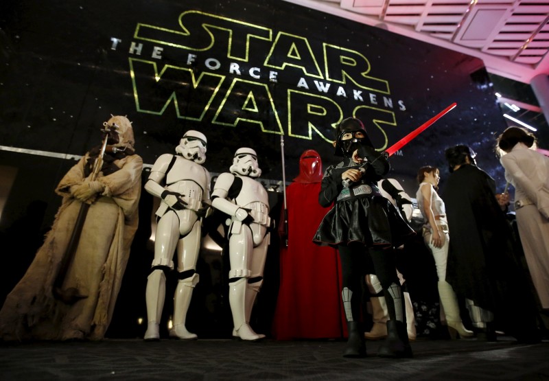 Moviegoers wait before the first showing of the movie "Star Wars: The Force Awakens" at the entrance of a movie theatre in Tokyo, Japan, December 18, 2015. Photo by Issei Kato, courtesy of Reuters.