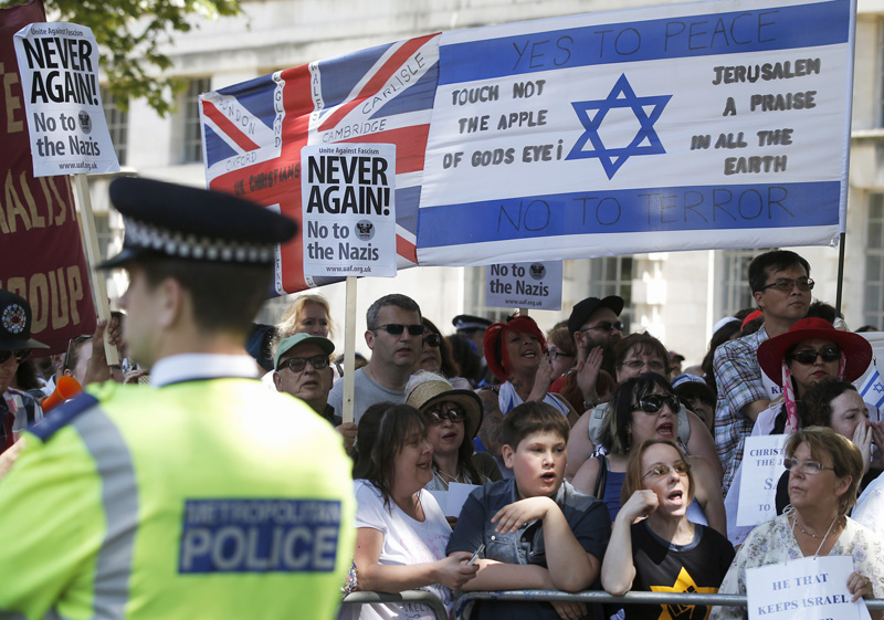 People of multiple faiths hold a counter-protest to an anti-Shomrim protest that was held to demonstrate against Britain's Jewish community in Westminster, London, Britain, on July 4, 2015. Photo courtesy of REUTERS/Peter Nicholls
*Editors: This photo may only be republished with RNS-LONDON-HATE, originally transmitted on Dec. 30, 2015.