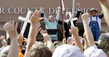 Rowan County Clerk Kim Davis, flanked by Republic presidential candidate Mike Huckabee, left, Attorney Mathew Staver, second right, and her husband Joe Davis, right, celebrates her release from the Carter County Detention center in Grayson, Kentucky on September 8, 2015. U.S. Photo courtesy of REUTERS/Chris Tilley *Editors: This photo may only be republished with RNS-MARSHALL-COLUMN, originally transmitted on September 10, 2015.