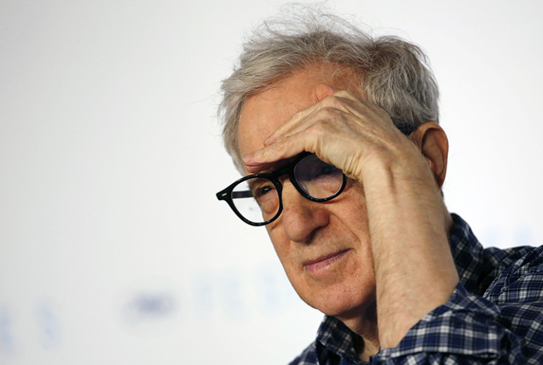 Director Woody Allen gestures as he attends a news conference for the film 