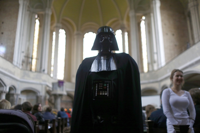 People dressed as characters from the movie Star Wars -- including iconic bad guy Darth Vader -- attend a service at the church Zionskirche in Berlin. Photo by Hannibal Hanschke courtesy of Reuters
