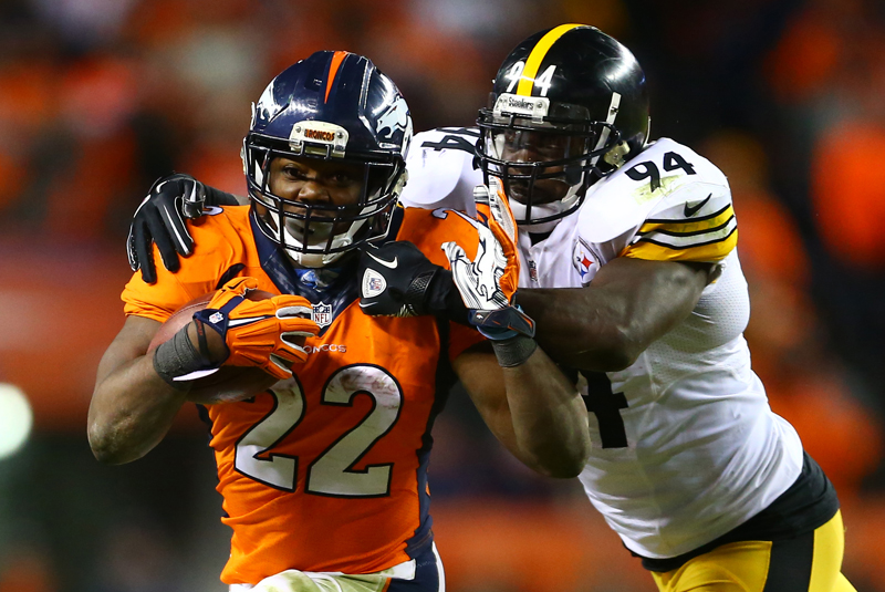 Denver Broncos running back C.J. Anderson (22) runs against Pittsburgh Steelers inside linebacker Lawrence Timmons (94) during the fourth quarter of the AFC Divisional round playoff game at Sports Authority Field at Mile High in Denver, Colo., on Jan. 17, 2016. Photo by Mark J. Rebilas-USA TODAY, courtesy of REUTERS *Editors: This photo may only be republished with RNS-FOOTBALL-VIOLENCE, originally transmitted on Jan. 28, 2016.