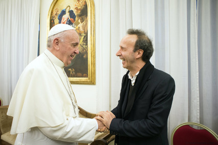 Pope Francis meets Italian actor Roberto Benigni during a private audience for Pope Francis' book "The Name of God is Mercy" at the Vatican, on January 11, 2016. Photo courtesy of REUTERS/Osservatore Romano/Handout via Reuters