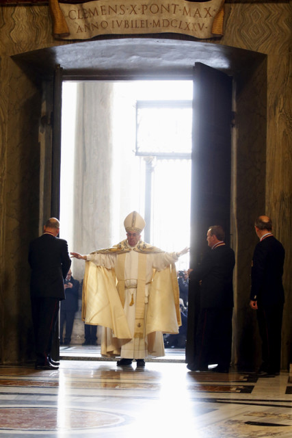 Pope Francis opens the Holy Door to mark opening of the Catholic Holy Year, or Jubilee, in St. Peter's basilica, at the Vatican, on December 8 ,2015. Photo courtesy of REUTERS/Alessandro Bianchi
*Editors: This photo may only be republished with RNS-POPE-INDULGENCES, orginally transmitted on Jan. 15, 2016.