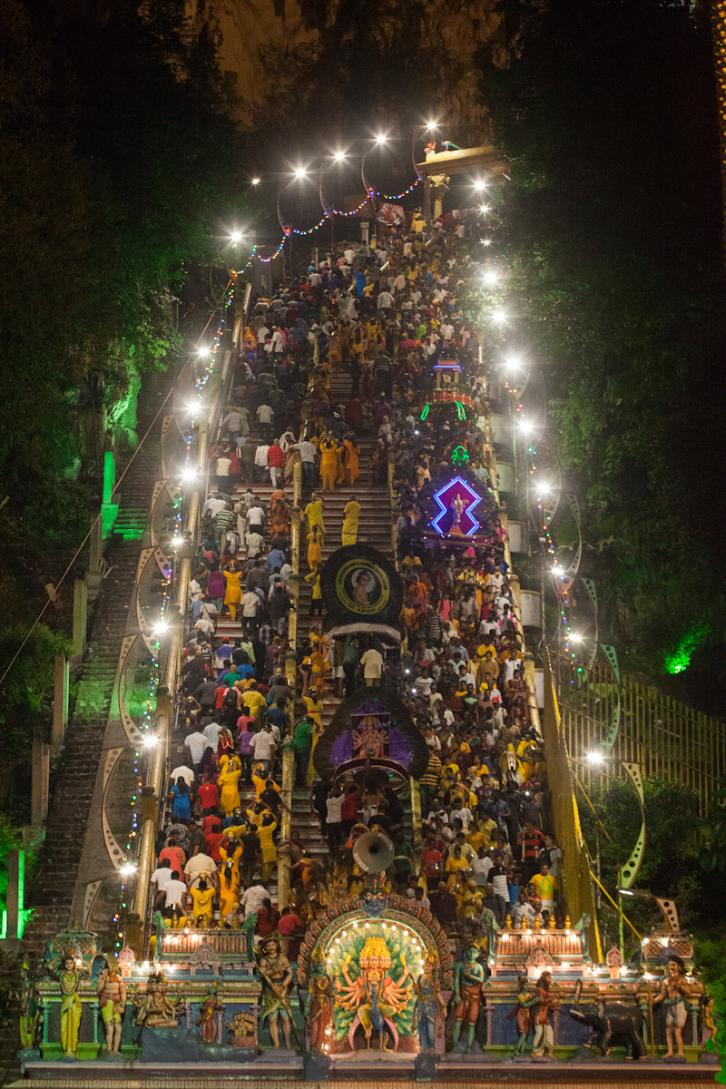 Hindu devotees climb the stairs leading to Lord Murugan's shrine in Batu Caves, Kuala Lumpur, to give offerings during the yearly Thaipusam Hindu festival. Religion News Service photo by Alexandra Radu