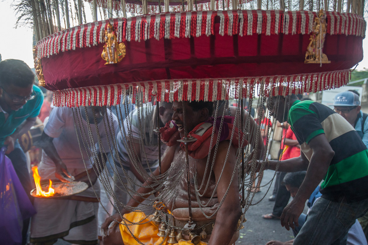 Hooks are being pierced into a Hindu devotee's skin before the beginning of his Thaipusam pilgrimage in Kuala Lumpur, Malaysia on Jan 24, 2016. Religion News Service photo by Alexandra Radu