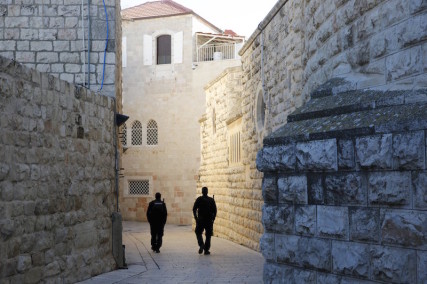 Israeli policemen walk near the Dormition Abbey in Jerusalem's Old City, after anti-Christian graffiti was found on some of it's exteriors. Photo by Ronen Zvulun courtesy of Reuters.