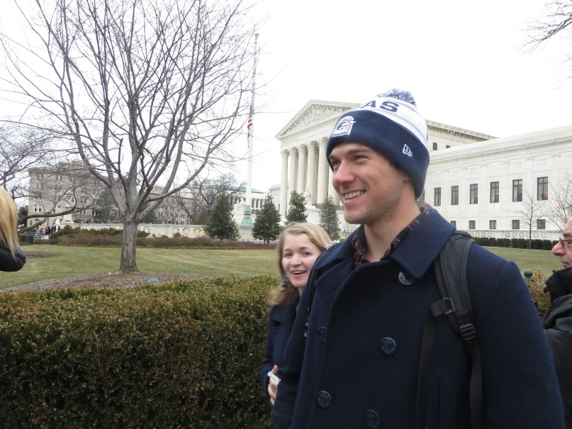 Ryan Shymanski, a Catholic Georgetown University student headed to law school, and admirer of former Supreme Court Justice Antonin Scalia, waits on line with his friend, fellow Georgetown student Olivia Hinerfeld, to pay their respects to Scalia, whose bodylay in repose at the Supreme Court Friday (Feb. 19). RNS Photo by Lauren Markoe.
