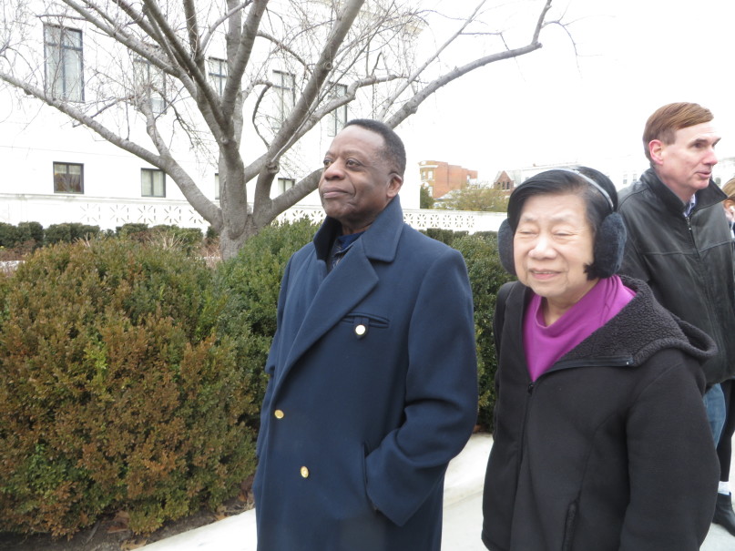 Marion Spann, left, and Rosalind Yee, both retired teachers from Maryland, met on line in near freezing temperatures to pay their respects to former Supreme Court Justice Antonin Scalia, whose body lay in repose Friday in the court’s Great Hall from 9:30 a.m. To 8 p.m. Spann said he didn’t necessarily agree with Scalia’s opinions, but respected his position. Yee said she admired Scalia as a conservative jurist and devout Catholic. RNS photo by Lauren Markoe.