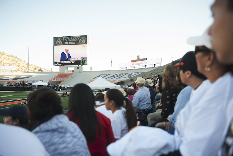 Thousands watch Pope Francis on the screen during a simulcast at the Sunbowl Stadium  in El Paso, Texas, February 17, 2016.  Pope Francis visited the once notorious Mexican border city of Ciudad Juarez on Wednesday, a major migrant crossing on the U.S. doorstep where grisly drug violence has killed thousands, to pray for those who risk their lives migrating north.  Photo courtesy REUTERS/Dan Dalstra