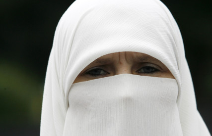 A woman wearing a niqab stands in front of the Parliament building during a protest in Sarajevo on July 26, 2010. Photo courtesy of REUTERS/Danilo Krstanovic  *Editors: This photo may only be republished with RNS-BOSNIA-HIJAB, originally transmitted on Feb. 8, 2016.