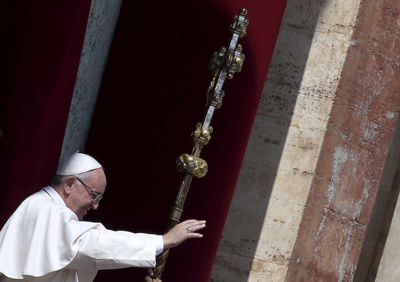 Pope Francis gestures during the delivery of the Urbi et Orbi benediction at the end of the Easter Mass in Saint Peter's Square at the Vatican March 27, 2016. Photo courtesy REUTERS/Alessandro Bianchi 