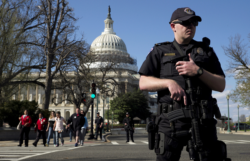 A U.S. Capitol police officer guards the perimeter on Independence Avenue in front of the U.S. Capitol Building as visitors are evacuated after a shooting at the U.S. Capitol Visitors Center in Washington on March 28, 2016. Photo courtesy of REUTERS/Joshua Roberts *Editors: This photo may only be repubulished with RNS-CAPITOL-GUNMAN, originally transmitted on March 29, 2016.