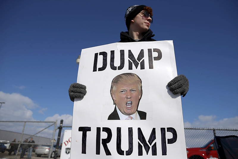 A protestor demonstrates outside a campaign rally for U.S. Republican presidential candidate Donald Trump in Cadillac, Michigan, on March 4, 2016. Photo courtesy of REUTERS/Jim Young
*Editors: This photo may only be republished with RNS-PALLY-COLUMN, originally transmitted on March 9, 2016.