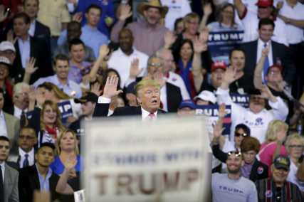 Republican U.S. presidential candidate Donald Trump asks his supporters to raise their hands and promise to vote for him at his campaign rally at the University of Central Florida in Orlando, Florida on March 5, 2016. Photo courtesy of REUTERS/Kevin Kolczynski