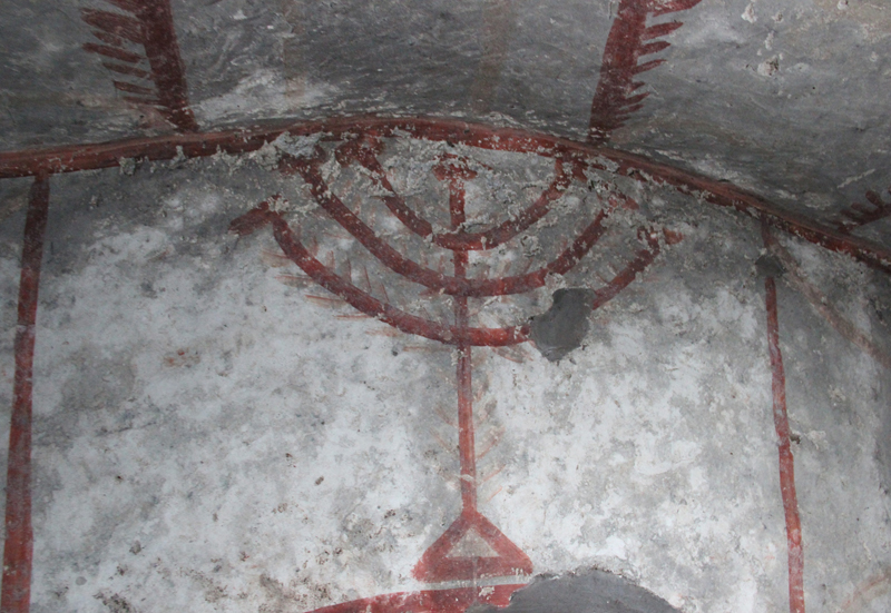 Fresco of a menorah inside the Jewish Catacombs on the outskirts of Rome, believed to date back to the 2nd Century AD. Religion News Service photo by Josephine McKenna