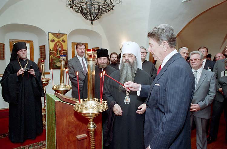 President Reagan lights candles during a visit to Danilov Monastery in Moscow on May 30, 1988. Photo courtesy of the Ronald Reagan Presidential Library.