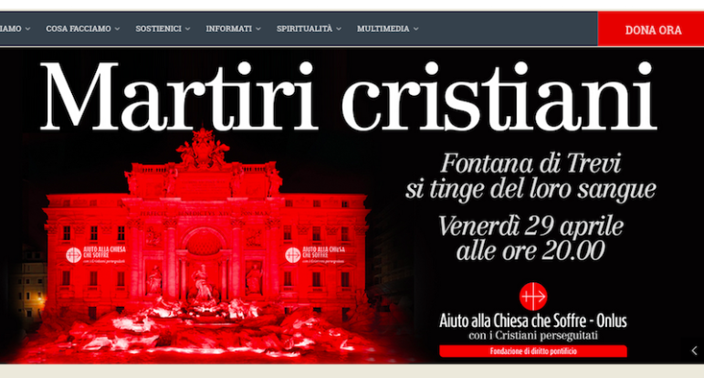 The home page from the Italian chapter of Aid to the Church in Need shows the Trevi Fountain lit in red to honor contemporary Christian martyrs. Photo via: http://acs-italia.org/ 
