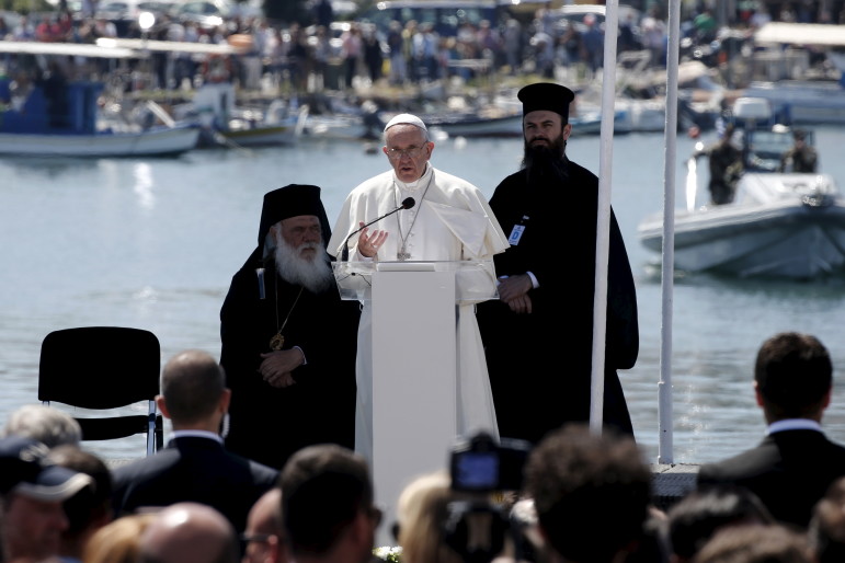 Pope Francis delivers his address at the port of Mytilene during his visit on Greek Island of Lesbos aiming at supporting refugees and drawing attention to the front line of Europe's migration crisis in Lesbos, April 16, 2016. Photo courtesy REUTERS/Alkis Konstantinidis