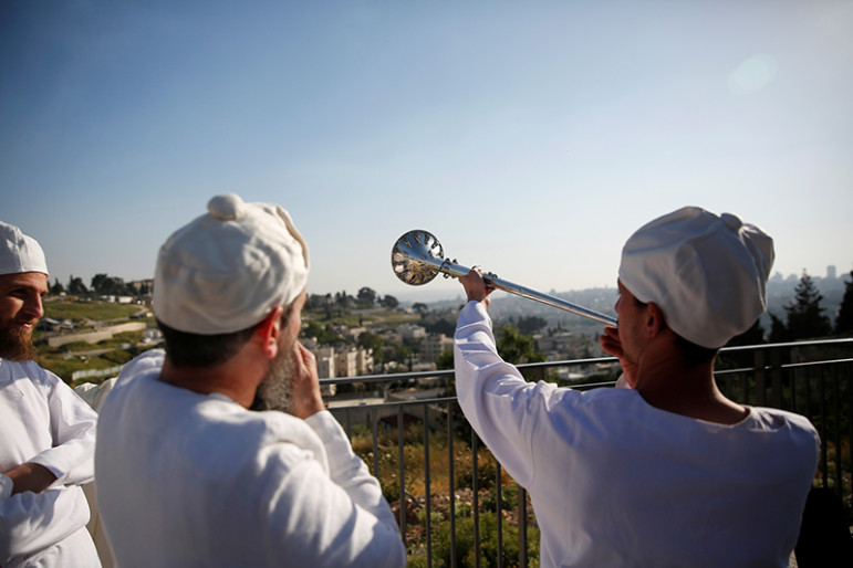 An Orthodox Jewish priest blows a trumpet before a reenactment ceremony of the Passover sacrifice in Jerusalem, on April 18, 2016. Photo courtesy of REUTERS/Ronen Zvulun
*Editors: This photo may only be republished with RNS-GROSSMAN-COLUMN, originally transmitted on April 21, 2016.