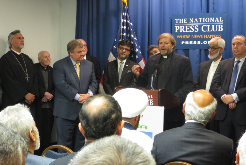 Rev. Ron Stief, at mic, chair of the Shoulder to Shoulder campaign against Islamophobia, speaks during a press conference pushing national political parties to reject anti-Muslim bigotry in the elections at the National Press Club in Washington, D.C. on April. 14, 2016. Religion News Service photo by Aysha Khan