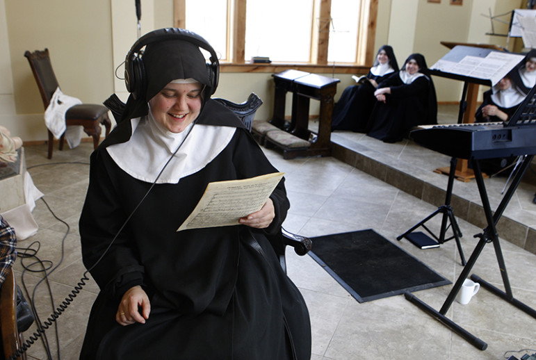 Mother Cecilia listens back to a recording while the singing nuns take a break, on February 18, 2016. The Benedictines of Mary, Queen of Apostles, are cloistered nuns who have had four albums top the charts. They released their latest album, 