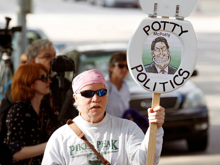 A protester takes part in a demonstration outside the state Legislature in Raleigh, N.C., on May 16, 2016. He carries a toilet seat mocking Republican politicians who approved the state’s so-called bathroom law. Photo courtesy of REUTERS/Jonathan Drake
*Editors: This photo may only be republished with RNS-HARTGROVE-OPED, originally transmitted on May 18, 2016.