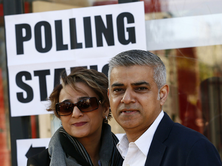 Sadiq Khan, Britain's Labour Party candidate for mayor of London, and his wife, Saadiya, pose for photographers after casting their votes in the race May 5, 2016. Photo courtesy REUTERS/Stefan Wermuth. Editors: This photo can only be used with RNS-KHAN-MAYOR published May 6, 2016.