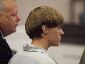 Dylann Roof, right, the 21-year-old man charged with murdering nine worshippers at a historic black church in Charleston, S.C., on June 17, 2015, listens to the proceedings with assistant defense attorney William Maguire during a hearing at the Judicial Center in Charleston on July 16, 2015. Photo courtesy REUTERS/Randall Hill *Editors: This photo may only be republished with RNS-CHARLESTON-ANNIVERSARY, originally transmitted on June 8, 2016.