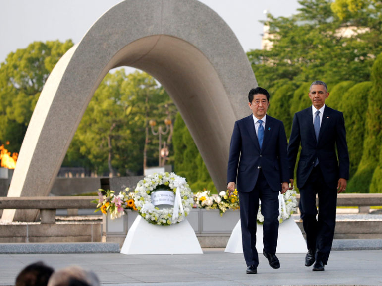 U.S. President Barack Obama, right, and Japanese Prime Minister Shinzo Abe walk in front of a cenotaph after they laid wreaths at Hiroshima Peace Memorial Park in Hiroshima, Japan on May 27, 2016. Photo courtesy REUTERS/Carlos Barria *EDs: This photo may only be used with RNS-LUPFER-OPED published on May 27, 2016.