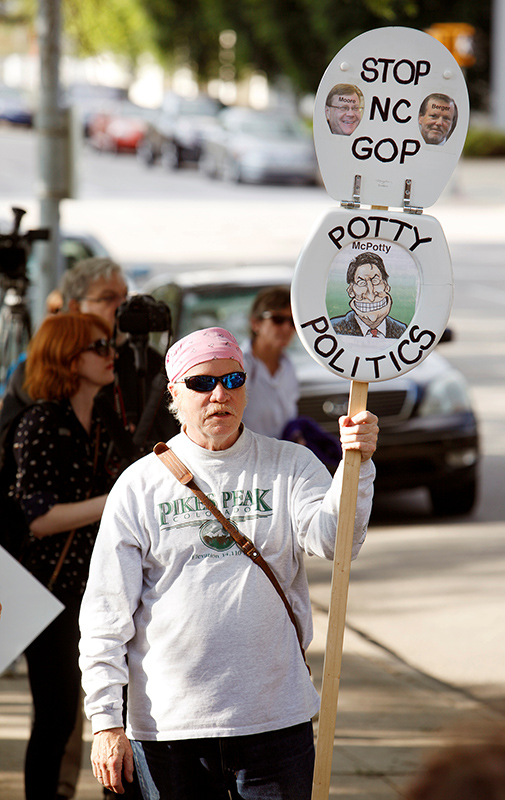 A protester carries a toilet seat mocking North Carlina's Republican politicians who passed and approved the state's so-called "bathroom law" during a demonstration outside the state legislature in Raleigh, North Carolina on May 16, 2016. Photo courtesy of REUTERS/Jonathan Drake *Editors: This photo may only be republished with RNS-HARTGROVE-OPED, originally transmitted on May 18, 2016.