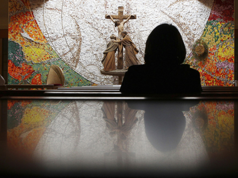 A visitor prays during Mass at a Roman Catholic Church in the village of Knock in County Mayo, in this photo taken on May 29, 2010. Photo courtesy of REUTERS/Cathal McNaughton 
*Editors: This photo may only be republished with RNS-IRISH-PRIEST, originally transmitted on May 5, 2016.