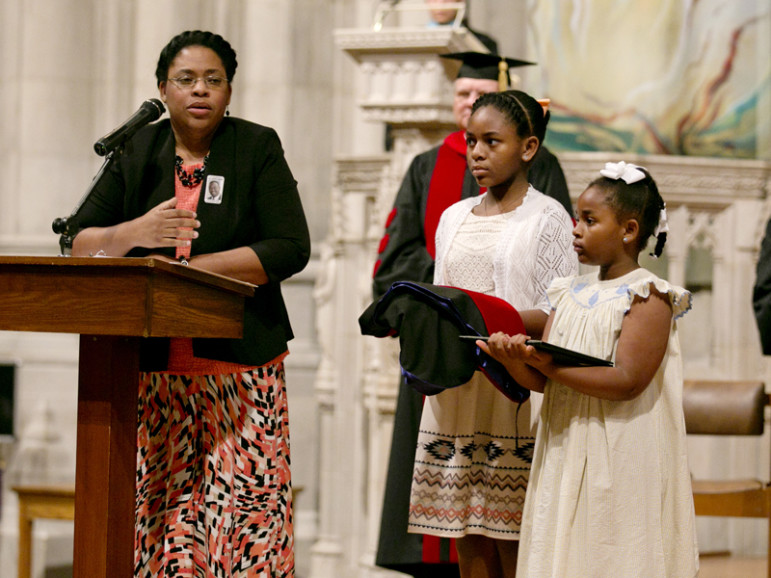 Jennifer Pinckney, far left, widow of the late Rev. Clementa Pinckney, stands with their daughters, Eliana and Malana, during the Wesley Theological Seminary commencement ceremony at the Washington National Cathedral on May 9, 2016. Photo by Lyndon Orinion, courtesy of Wesley Theological Seminary