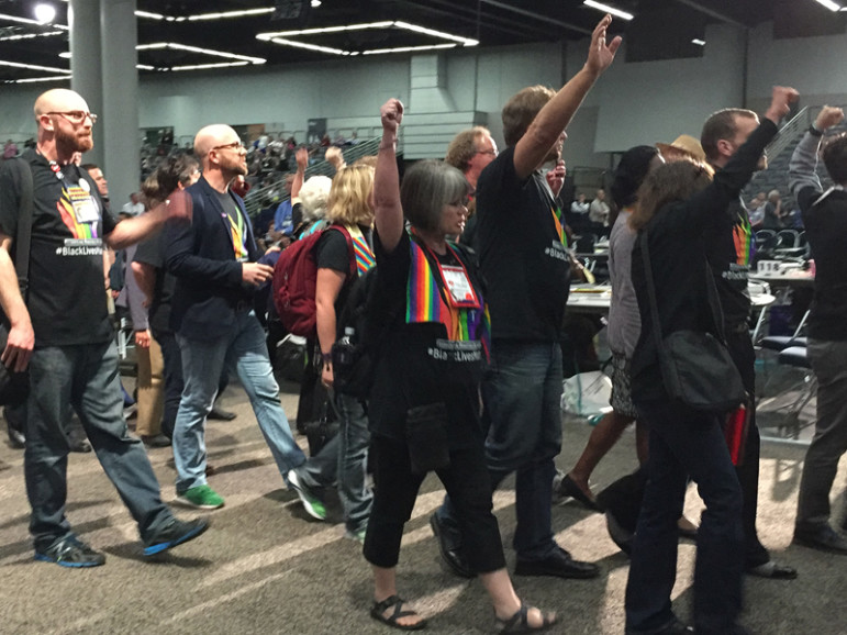 About 150 protestors shut down the afternoon plenary session on May 16, 2016, during the United Methodist General Conference for about 20 minutes as the quadrennial conference started its second week. Religion News Service photo by Emily Miller