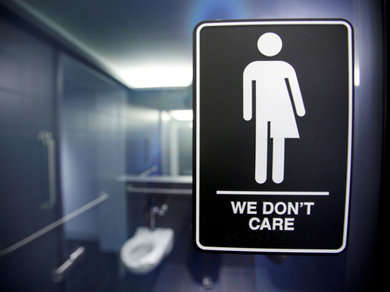 A sign protesting a recent North Carolina law restricting transgender bathroom access is seen in the bathroom stalls at the 21C Museum Hotel in Durham, North Carolina on May 3, 2016. Photo couresty of REUTERS/Jonathan Drake/File photo   
*Editors: This photo may only be republished with RNS-WAX-COLUMN, originally transmitted on May 24, 2016.