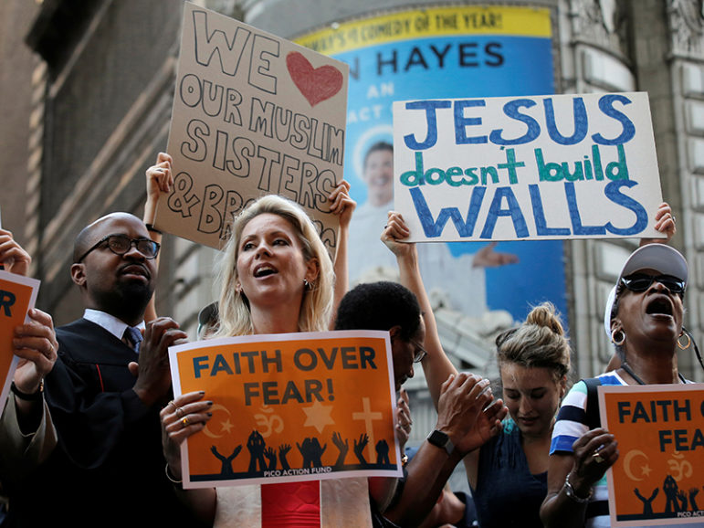 Interfaith religious leaders protest against Republican  presidential candidate Donald Trump outside a hotel where he was to meet with evangelical leaders in New York on June 21, 2016. Photo courtesy of REUTERS/Brendan McDermid