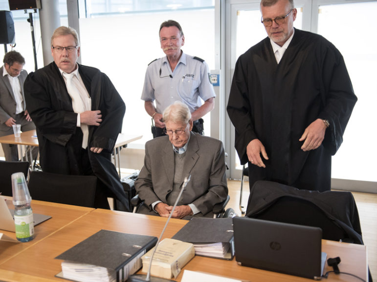 Defendant Reinhold Hanning, a 94-year-old former guard at Auschwitz death camp, sits between his lawyers Andreas Scharmer (L) and Johannes Salmen in a courtroom before the continuation of his trial in Detmold, Germany, May 20, 2016.  Photo courtesy REUTERS/Bernd Thissen/Pool 