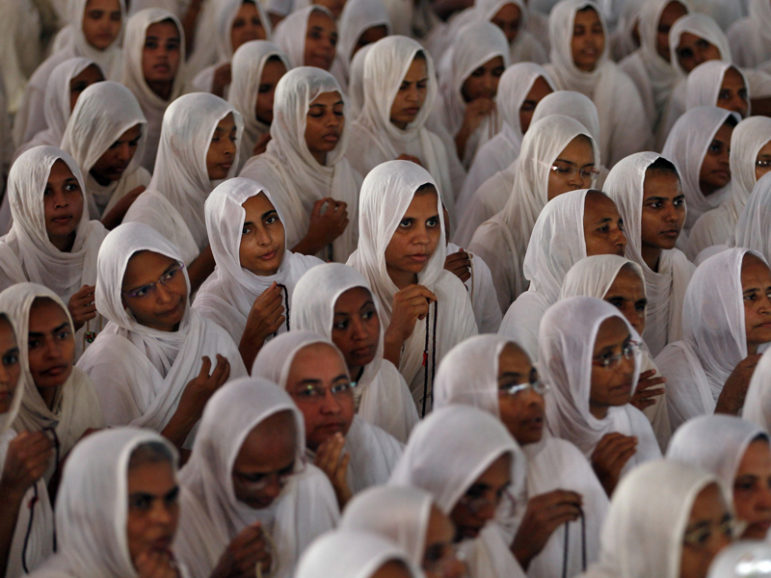 Women from the Jain community, followers of a religion founded by Mahavir, attend a prayer meeting for world peace in the western Indian city of Ahmedabad September 28, 2014.  Photo courtesy REUTERS/Amit Dave 