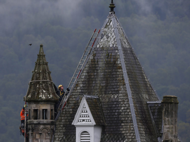 Steeplejacks perform a routine inspection on a church roof in Pitlochry, Scotland, on June 5, 2015. Photo courtesy REUTERS/Russell Cheyne Eds: This photo may be used with RNS-SCOTTISH-MARRIAGE, transmitted June 10, 2016.