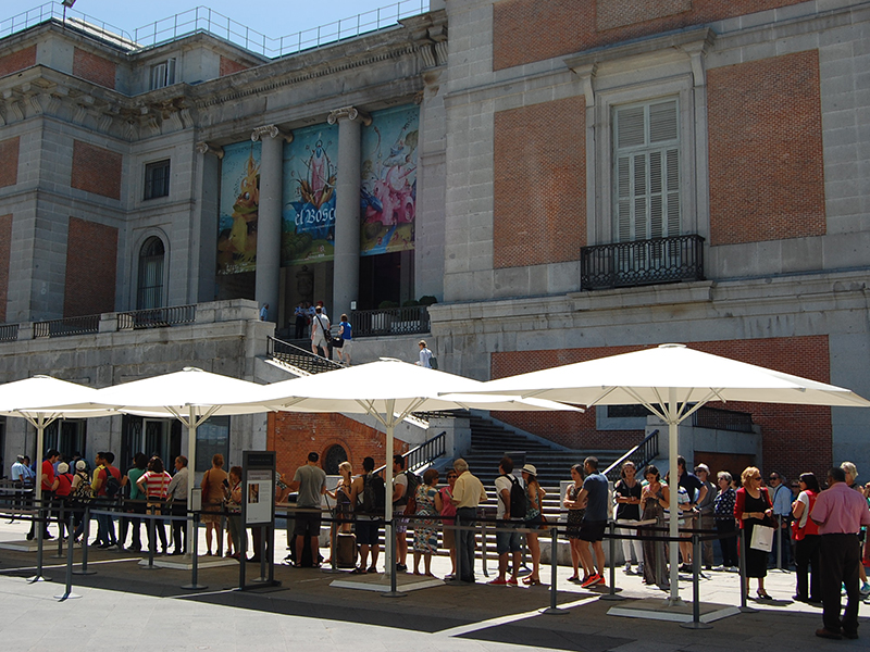 People wait in line for tickets to the exhibition "Bosch: The 5th Centenary Exhibition" at the Museo Nacional del Prado in Madrid, Spain. Photo by Wanda Rodriguez