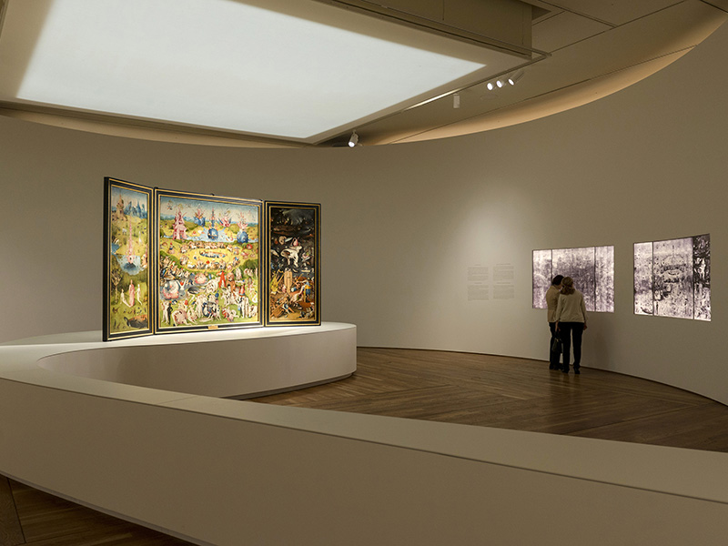 Installation view of "Bosch: The 5th Centenary Exhibition," with "The Garden of Earthly Delights" on the left and X-radiographs of the painting on the right, in the Museo Nacional de Prado in Madrid, Spain. Photo courtesy of Museo Nacional del Prado