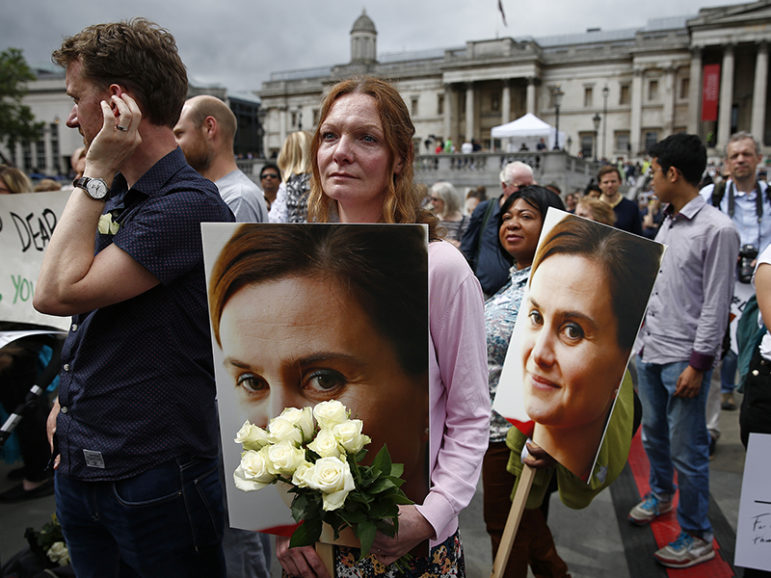 A woman holds a placard and white roses during a special service for slain Labour Party MP Jo Cox, at Trafalgar Square in London, on June 22, 2016. Photo courtesy of REUTERS/Peter Nicholls
*Editors: This photo may only be republished with RNS-BRITISH-HATE, originally transmitted on June 30, 2016.