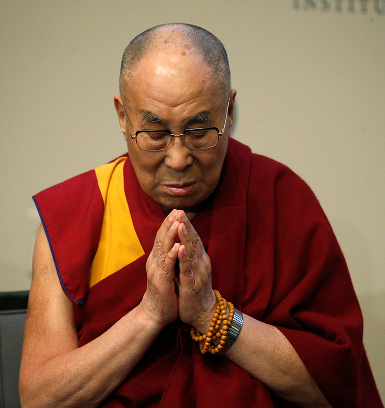 The Dalai Lama prays for the victims of the Orlando shootings before speaking at the U.S. Institute of Peace in Washington, D.C., on June 13, 2016. Photo courtesy of Reuters/Kevin Lamarque