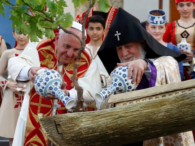 Pope Francis (left) and Catholicos of All Armenians Karekin II (right) water a tree planted in an Noah's Ark model during an ecumenical service at the Republic Square on June 25, 2016, in Yerevan, Armenia. Photo by Alessandro Bianchi/REUTERS