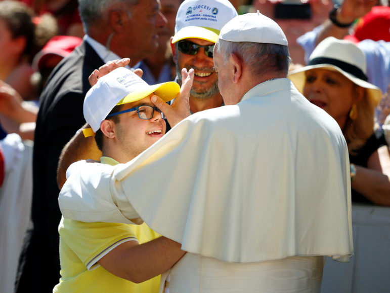 Pope Francis blesses a boy as he arrives to lead a special Jubilee audience in Saint Peter's square at the Vatican on June 18, 2016. Photo courtesy of REUTERS/Tony Gentile 
*Editors: This photo may only be republished with RNS-POPE-HYPOCRISY, originally transmitted on June 20, 2016.