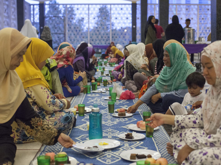 Muslim women break the fast at the National Mosque in Kuala Lumpur, Malaysia, on the first day of Ramadan, June 6, 2016. RNS photo by Alexandra Radu