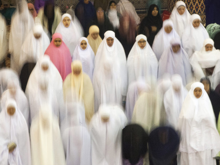 Muslim women bow during evening prayer at the National Mosque in Kuala Lumpur, Malaysia, on the first day of the month of Ramadan on June 6, 2016. RNS photo by Alexandra Radu