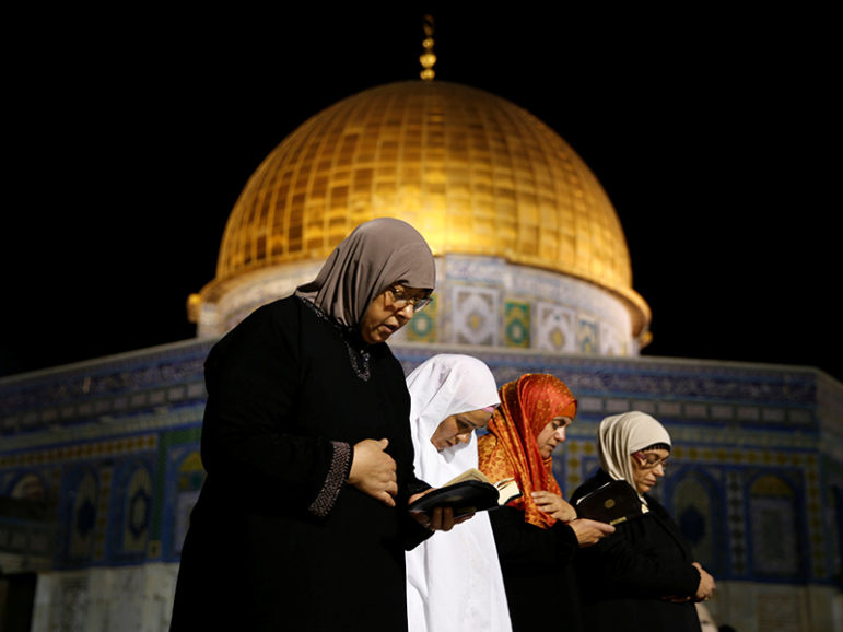 Palestinian women pray in front of the Dome of the Rock, at the compound known to Muslims as Noble Sanctuary and to Jews as the Temple Mount, in Jerusalem's Old City during the holy month of Ramadan on June 7, 2016. Photo by Ammar Awad/Reuters