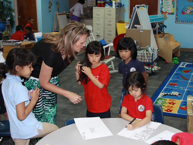 Kelli Czaykowsky assists refugee children at a Seventh-day Adventist school in Duluth, Ga., on May 14, 2015. Photo courtesy of Allen Clark